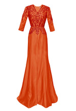 orange evening gown with sleeves